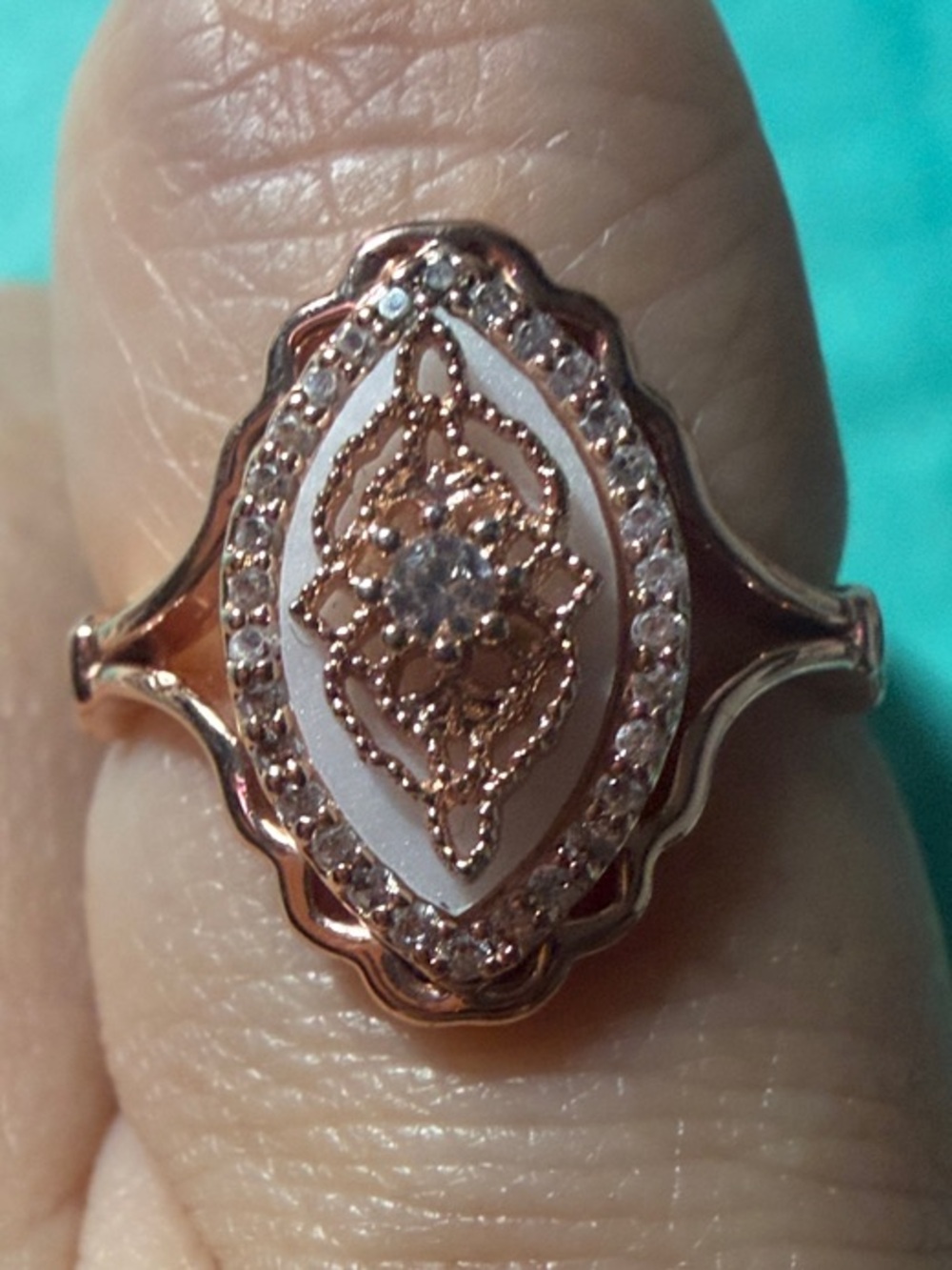 Elegant Rose Gold Oval Filigree Ring with White Enamel and Center Stone